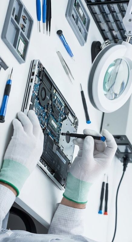 Technician repairing computer hardware components